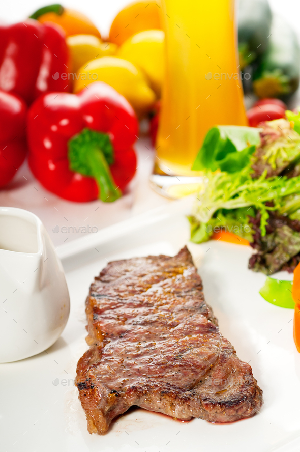 juicy BBQ grilled rib eye ,ribeye steak and vegetables Stock Photo by